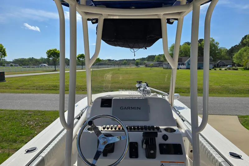 Slide: The Image of 2024 Carolina Skiff 24 Ultra Elite boat dashboard with Garmin navigation system. - 34