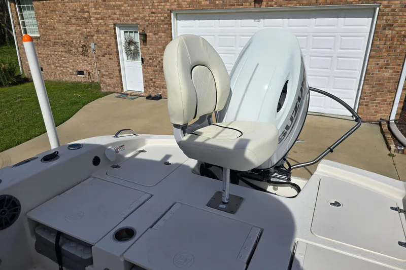 Slide: The Image of 2024 Carolina Skiff 24 Ultra Elite boat with Suzuki outboard motor in driveway. - 37