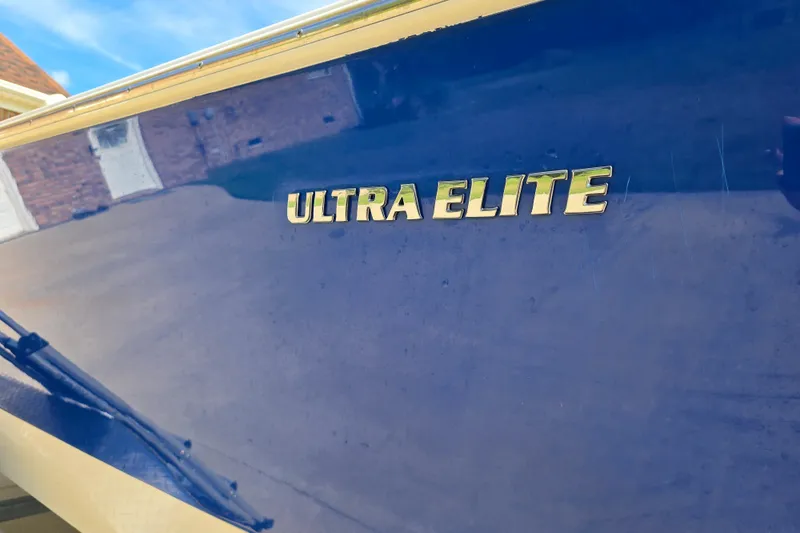 Slide: The Image of 2024 Carolina Skiff 24 Ultra Elite boat with "Ultra Elite" logo on blue hull. - 8