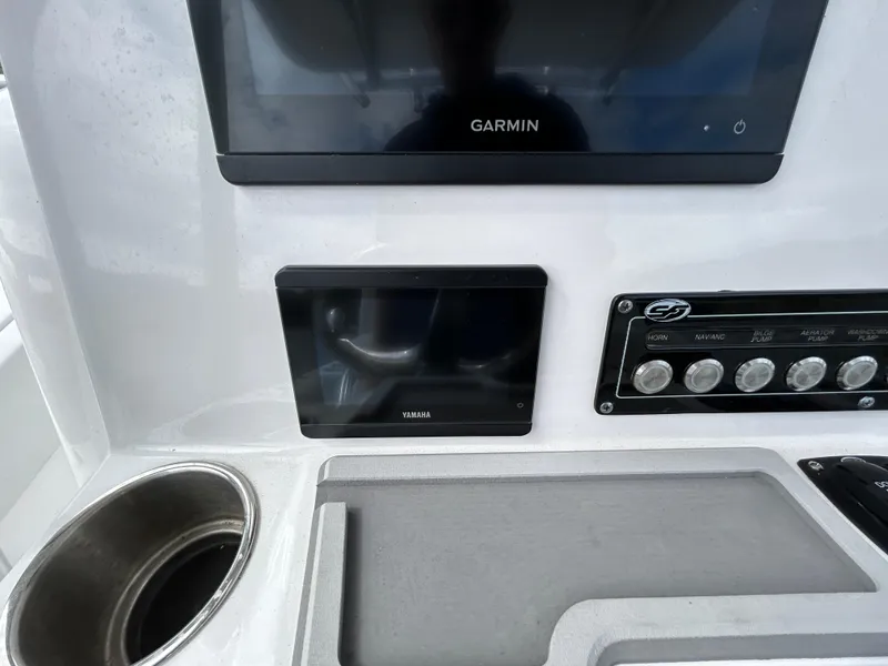 Slide: The Image of Sea Fox 248 Commander 2025 dashboard with Garmin and Yamaha displays. - 11