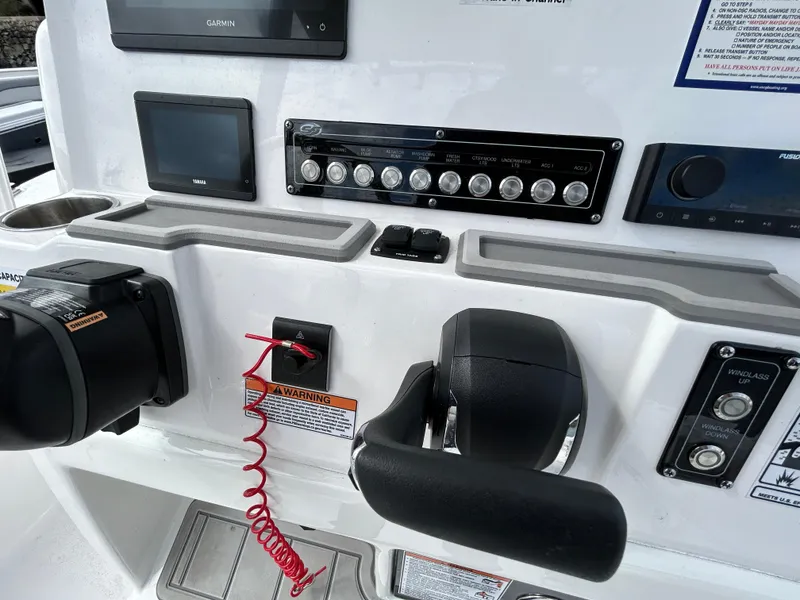 Slide: The Image of Control panel of 2025 Sea Fox 248 Commander boat with navigation and throttle systems. - 13