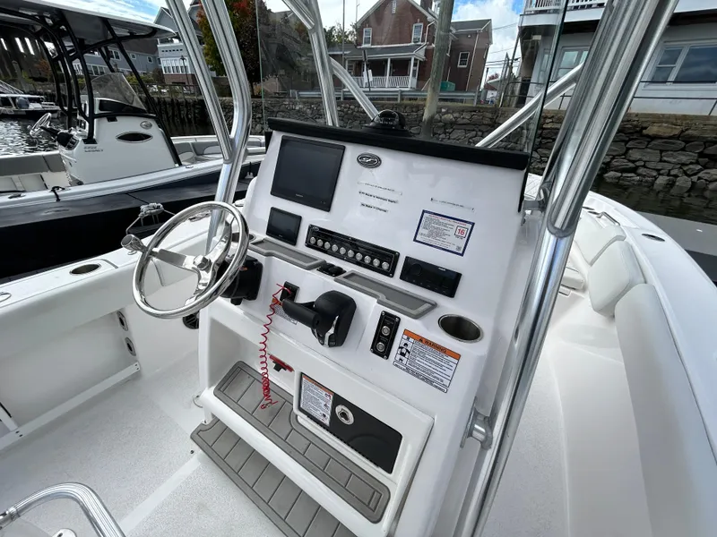 Slide: The Image of 2025 Sea Fox 248 Commander boat console with steering wheel and controls. - 20