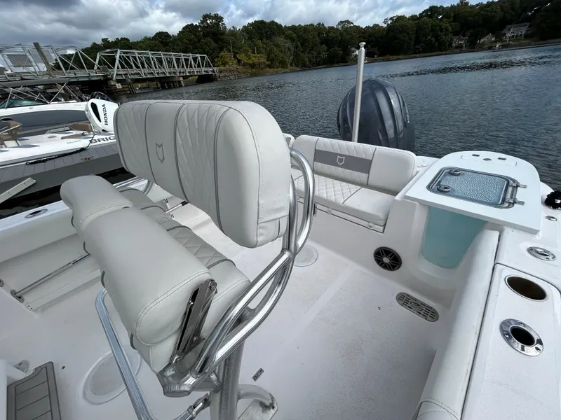 Slide: The Image of 2025 Sea Fox 248 Commander boat interior with seating and water view. - 26