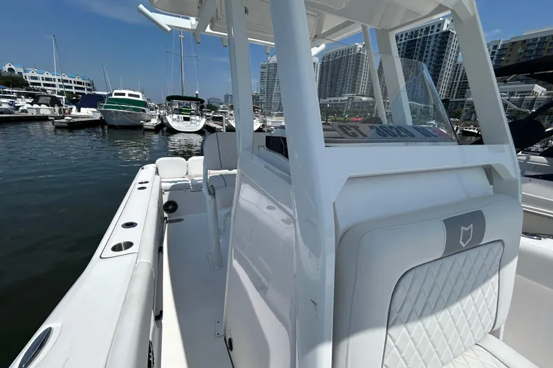 Slide: The Image of 2025 Sea Fox 248 Commander boat docked at marina with modern design. - 10