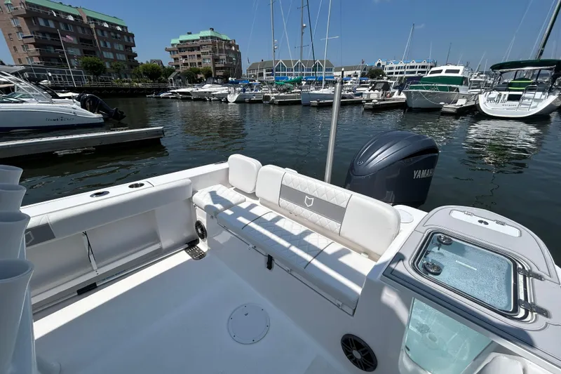 Slide: The Image of 2025 Sea Fox 248 Commander boat docked in a marina, featuring a Yamaha engine. - 12