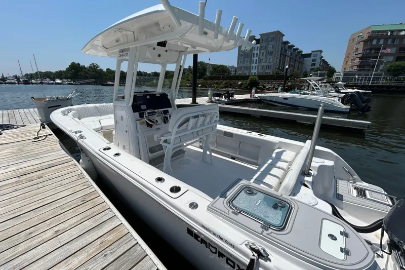 Slide: The Image of 2025 Sea Fox 248 Commander boat docked at marina, featuring sleek design and spacious seating. - 3