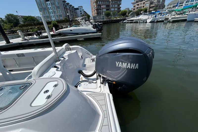 Slide: The Image of 2025 Sea Fox 248 Commander with Yamaha engine docked in a marina. - 5