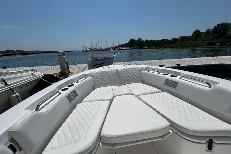Slide: The Image of Luxurious seating on 2025 Sea Fox 248 Commander boat docked by the water. - 8