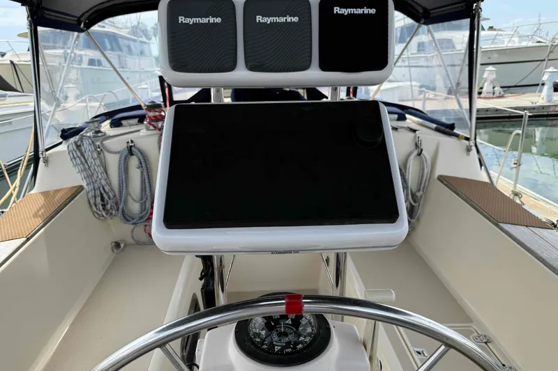 Slide: The Image of Cockpit of 1998 Island Packet 40 sailboat with Raymarine navigation equipment. - 2