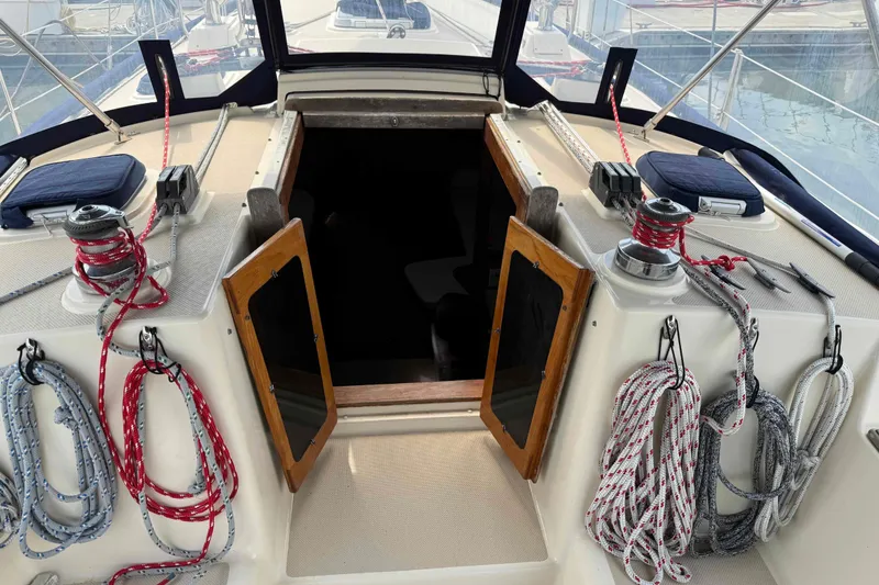 Slide: The Image of Cockpit view of a 1998 Island Packet 40 sailboat with ropes and winches. - 3