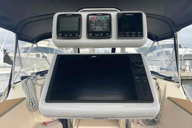 Slide: The Image of Cockpit of 1998 Island Packet 40 sailboat with navigation instruments and display. - 37