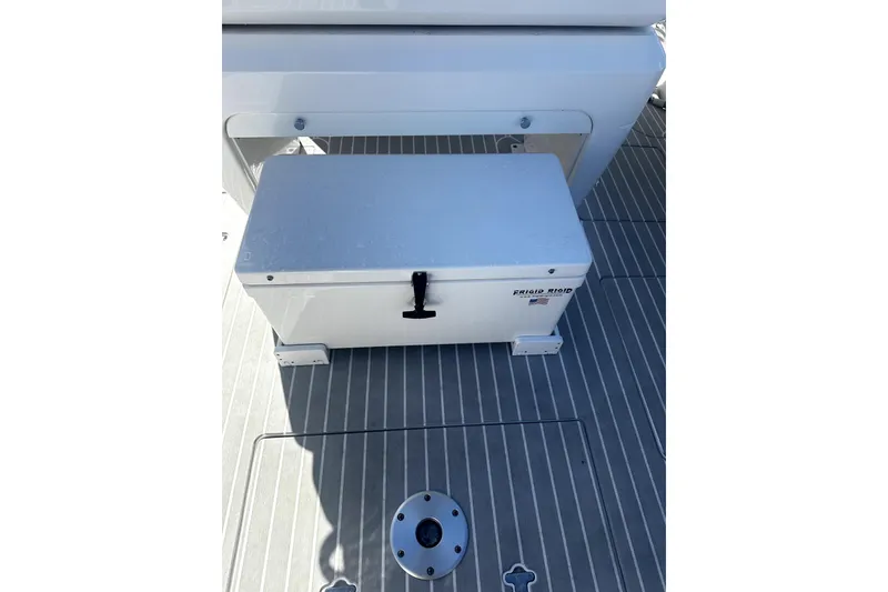 Slide: The Image of Frigid Rigid cooler on 2020 Intrepid 327 Center Console boat deck. - 7