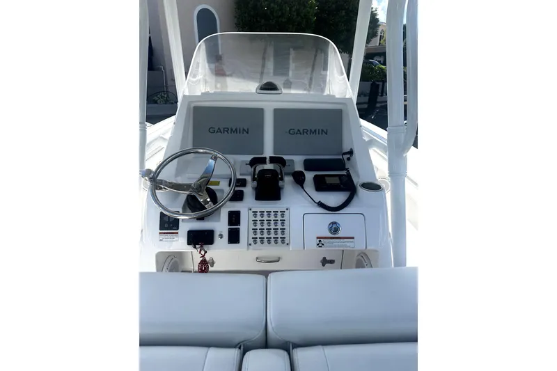 Slide: The Image of 2020 Intrepid 327 Center Console boat dashboard with Garmin navigation system. - 8