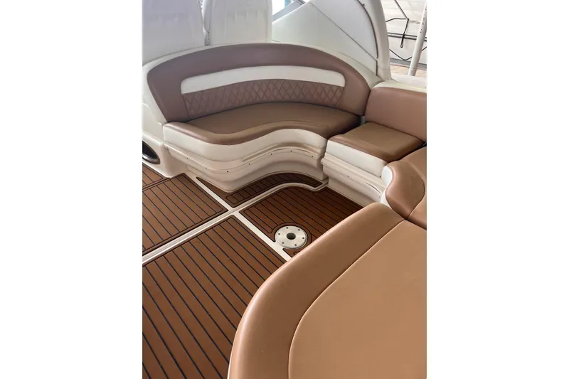 Slide: The Image of Luxurious seating area on 2005 Sea Ray 340 Sundancer boat with brown upholstery. - 12