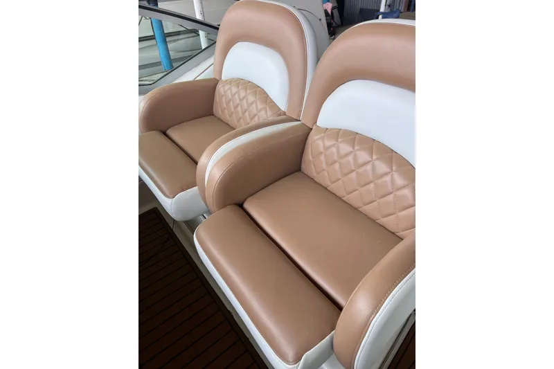 Slide: The Image of Luxurious tan and white seating on 2005 Sea Ray 340 Sundancer boat. - 13