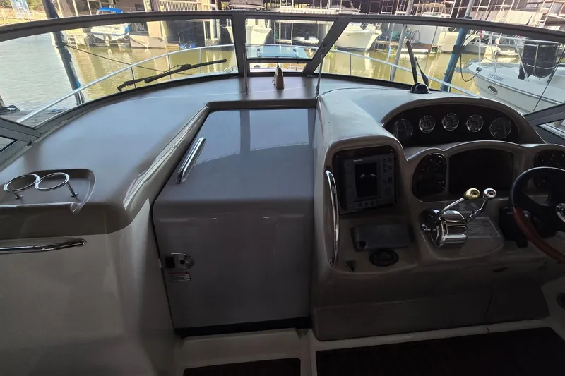 Slide: The Image of Cockpit of 2005 Sea Ray 340 Sundancer with navigation controls and gauges. - 17