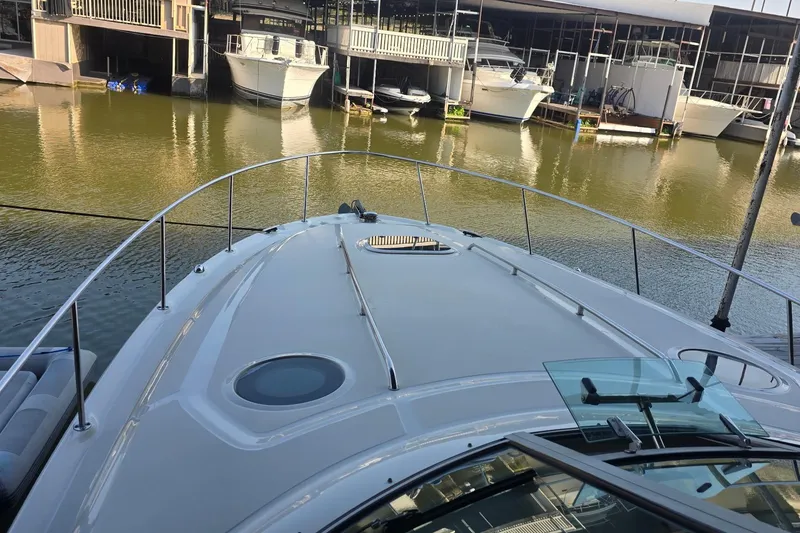 Slide: The Image of 2005 Sea Ray 340 Sundancer yacht docked at marina, viewed from bow. - 18