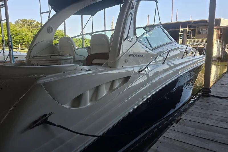 Slide: The Image of 2005 Sea Ray 340 Sundancer docked, showcasing sleek design and luxurious interior. - 21