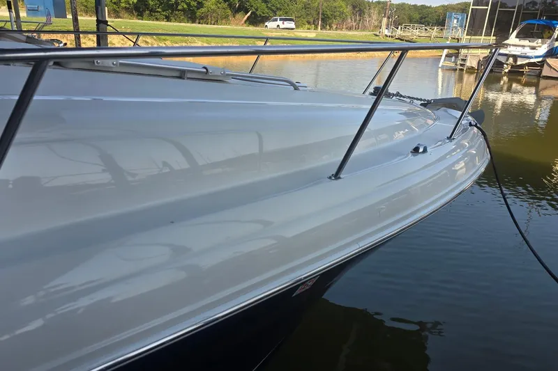 Slide: The Image of 2005 Sea Ray 340 Sundancer yacht docked at marina, reflecting on calm water. - 23