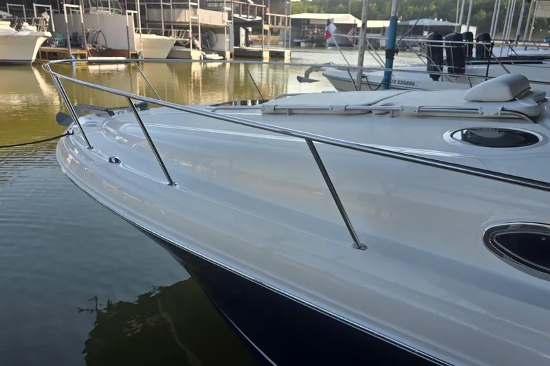 Slide: The Image of 2005 Sea Ray 340 Sundancer yacht docked at marina, showcasing sleek design and polished finish. - 26