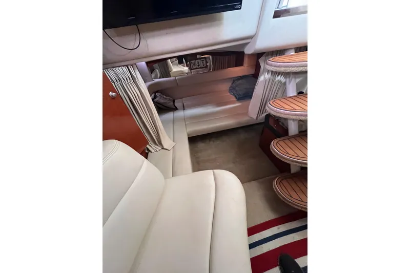 Slide: The Image of Interior of 2005 Sea Ray 340 Sundancer yacht with seating and wooden steps. - 4