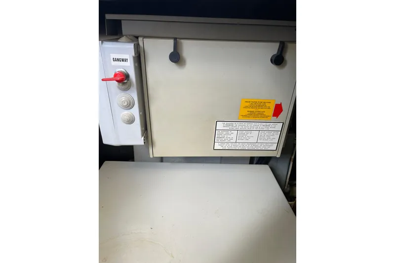 Slide: The Image of Control panel on a 2000 Azimut 46 Flybridge MY yacht, featuring gangway controls. - 104