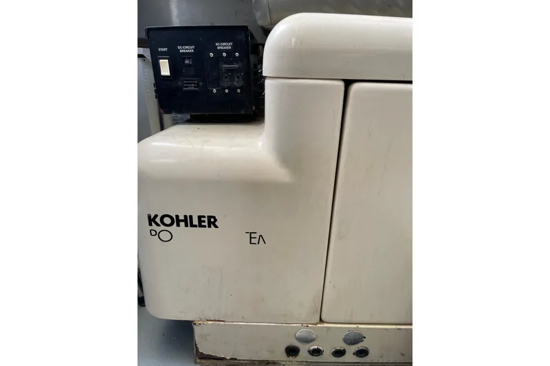 Slide: The Image of Kohler generator on 2000 Azimut 46 Flybridge MY yacht, featuring control panel. - 105
