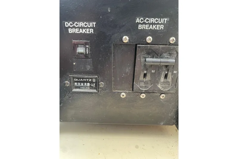Slide: The Image of Electrical panel with DC and AC circuit breakers on 2000 Azimut 46 Flybridge MY. - 106
