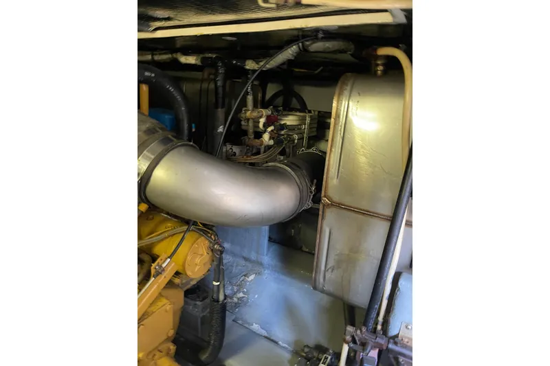 Slide: The Image of Engine room of 2000 Azimut 46 Flybridge MY yacht, showcasing mechanical components. - 110