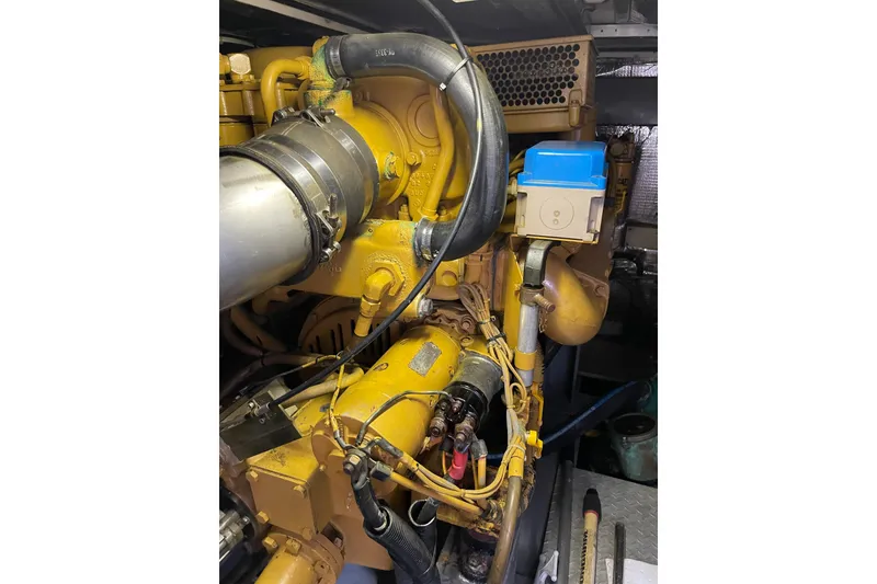 Slide: The Image of Engine compartment of 2000 Azimut 46 Flybridge MY, showcasing mechanical components. - 111