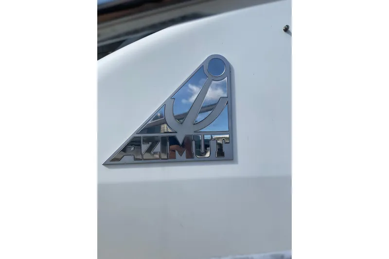Slide: The Image of Azimut 46 Flybridge MY 2000 logo on white yacht surface. - 14