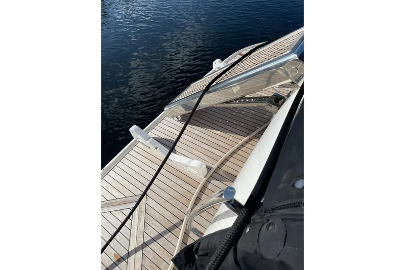 Slide: The Image of Azimut 46 Flybridge MY 2000 yacht deck with wooden finish and railing. - 15