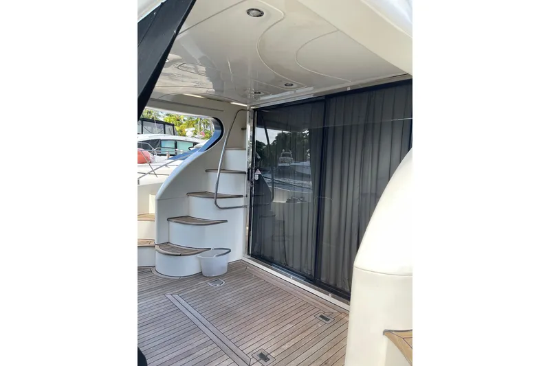 Slide: The Image of Azimut 46 Flybridge MY 2000 yacht interior with wooden stairs and sliding glass door. - 19