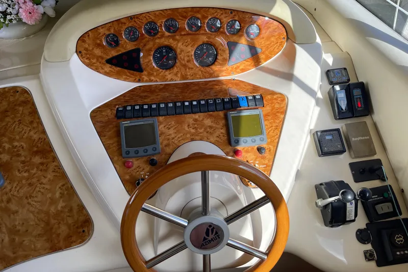 Slide: The Image of Cockpit of 2000 Azimut 46 Flybridge MY with wood accents and navigation instruments. - 24