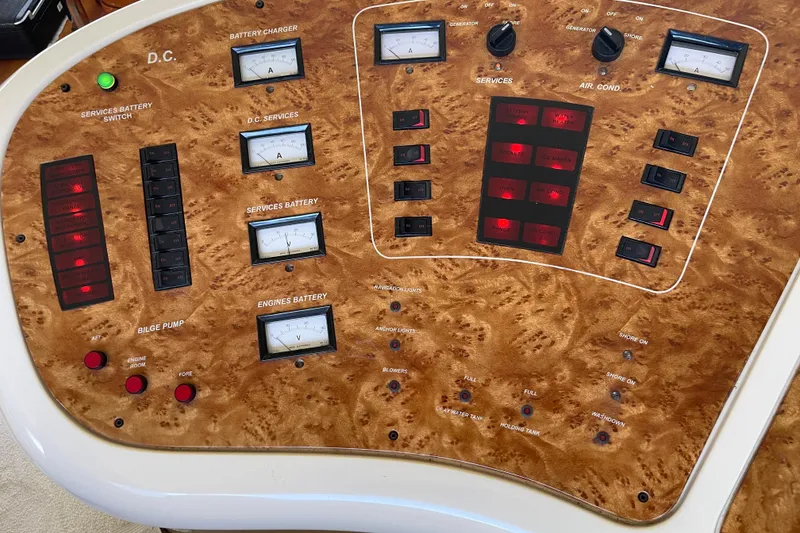 Slide: The Image of Control panel of a 2000 Azimut 46 Flybridge MY yacht with various switches and gauges. - 25