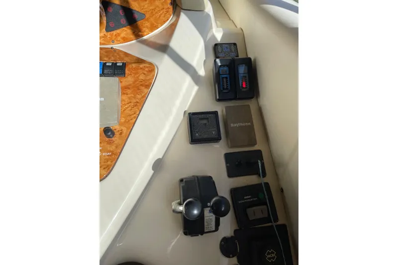Slide: The Image of Control panel of a 2000 Azimut 46 Flybridge MY yacht with various navigation instruments. - 26