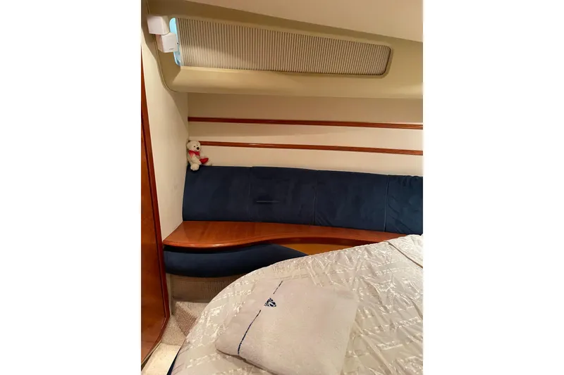 Slide: The Image of Interior of 2000 Azimut 46 Flybridge MY yacht with cozy seating and plush decor. - 29