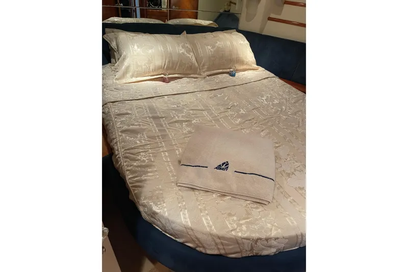 Slide: The Image of Luxurious bed with embroidered linens on Azimut 46 Flybridge MY, 2000 model yacht. - 30