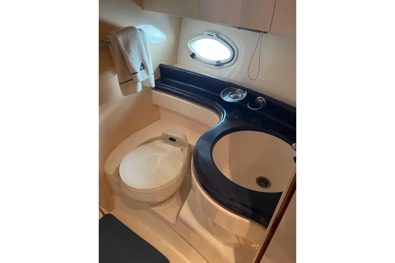 Slide: The Image of Bathroom interior of 2000 Azimut 46 Flybridge MY yacht, featuring sink and toilet. - 32