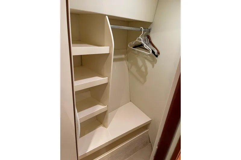 Slide: The Image of Azimut 46 Flybridge MY 2000 yacht closet with shelves and hangers. - 35