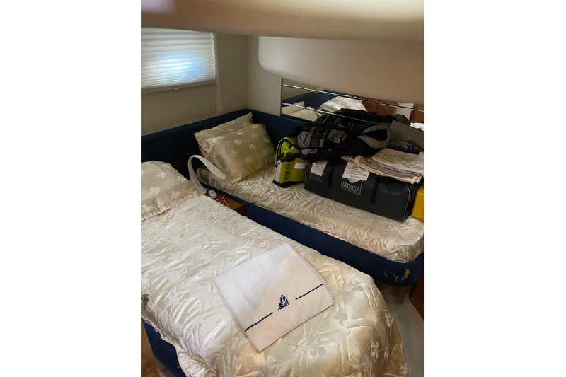 Slide: The Image of Interior cabin of 2000 Azimut 46 Flybridge MY with twin beds and nautical decor. - 39