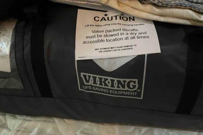Slide: The Image of Liferaft in Viking bag with caution label, Azimut 46 Flybridge MY, 2000 model. - 40