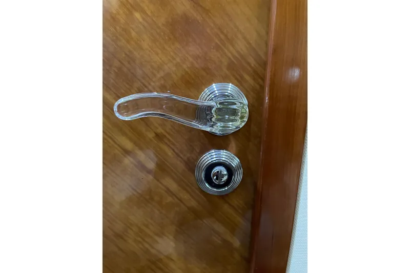 Slide: The Image of Chrome door handle and lock on Azimut 46 Flybridge MY, 2000 model yacht. - 43