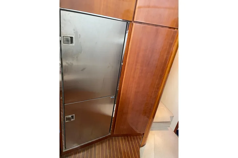 Slide: The Image of Stainless steel fridge on Azimut 46 Flybridge MY, 2000 model, with wooden cabinetry. - 44