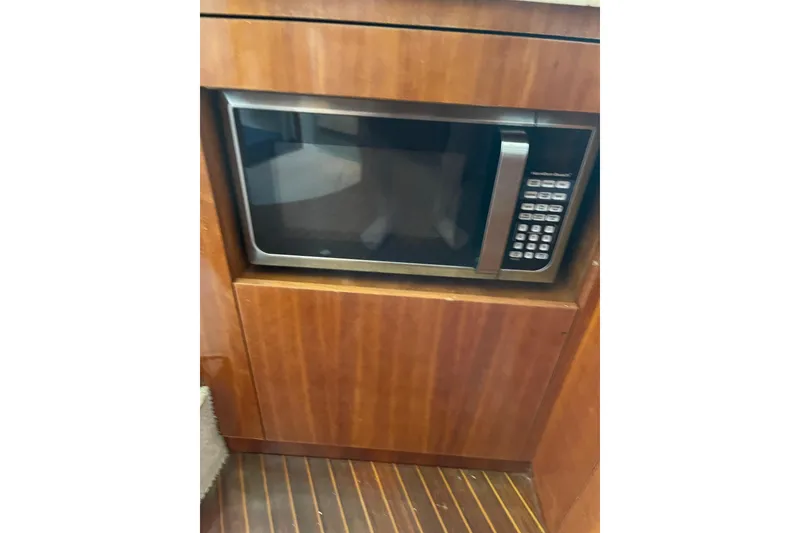 Slide: The Image of Microwave in wooden cabinet on 2000 Azimut 46 Flybridge yacht. - 48