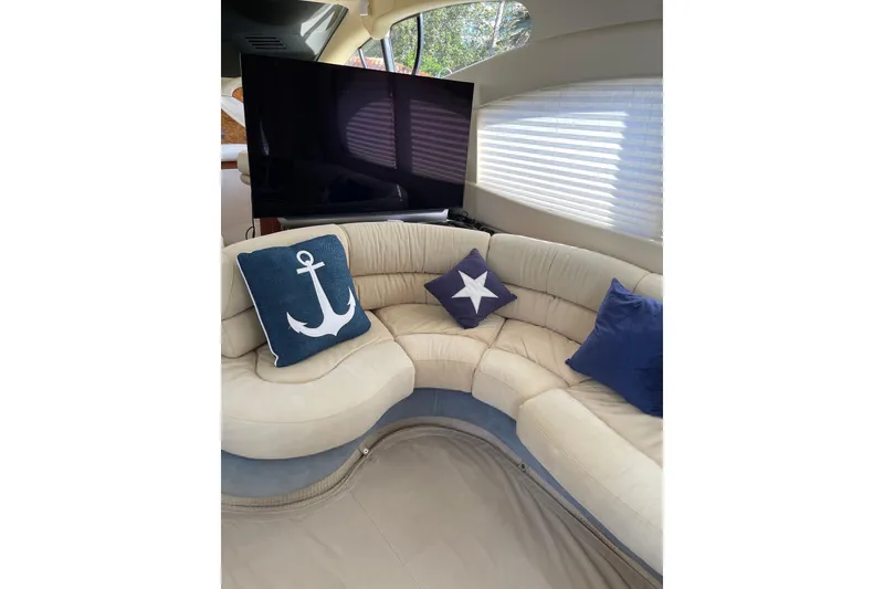 Slide: The Image of Luxurious interior of 2000 Azimut 46 Flybridge yacht with nautical-themed cushions. - 57
