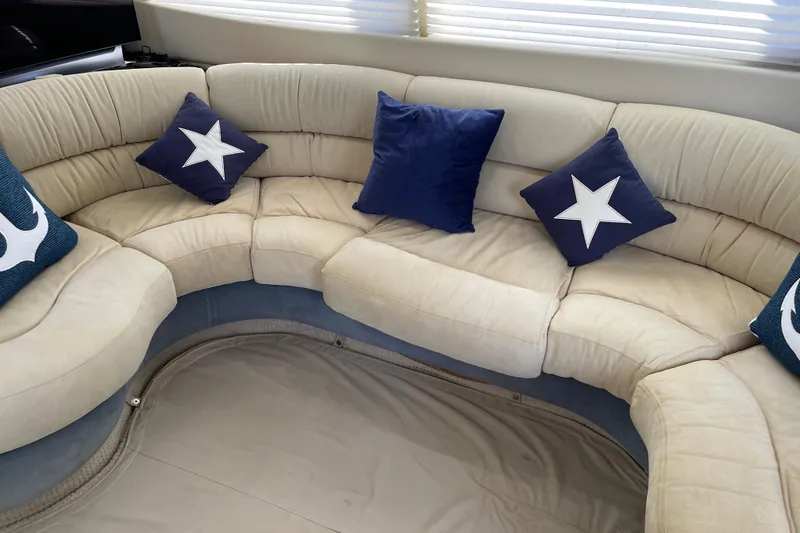 Slide: The Image of Luxurious Azimut 46 Flybridge MY 2000 yacht interior with star-themed cushions. - 59