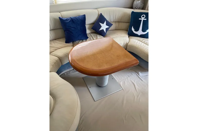 Slide: The Image of Luxurious Azimut 46 Flybridge MY 2000 yacht interior with elegant seating and nautical-themed cushions. - 69