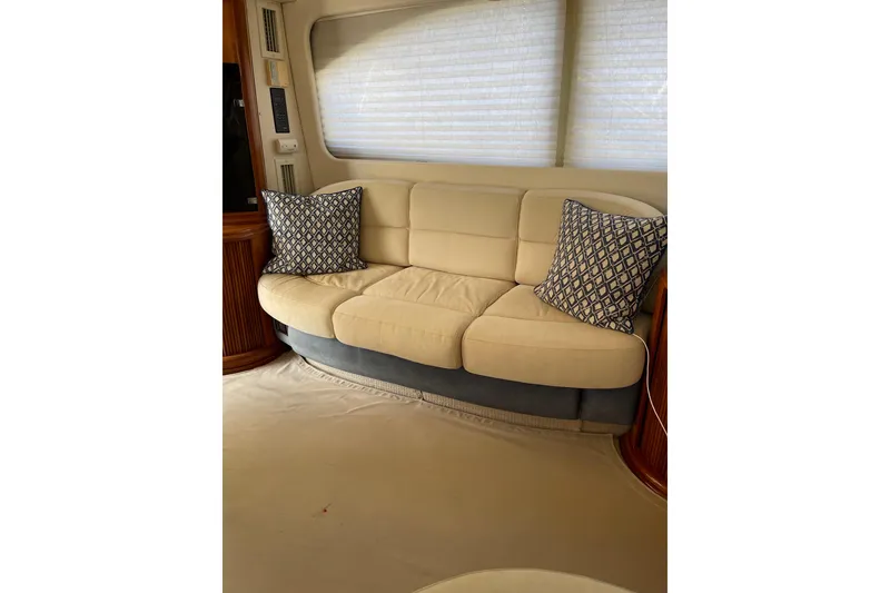 Slide: The Image of Luxurious interior of 2000 Azimut 46 Flybridge MY with beige sofa and patterned cushions. - 71