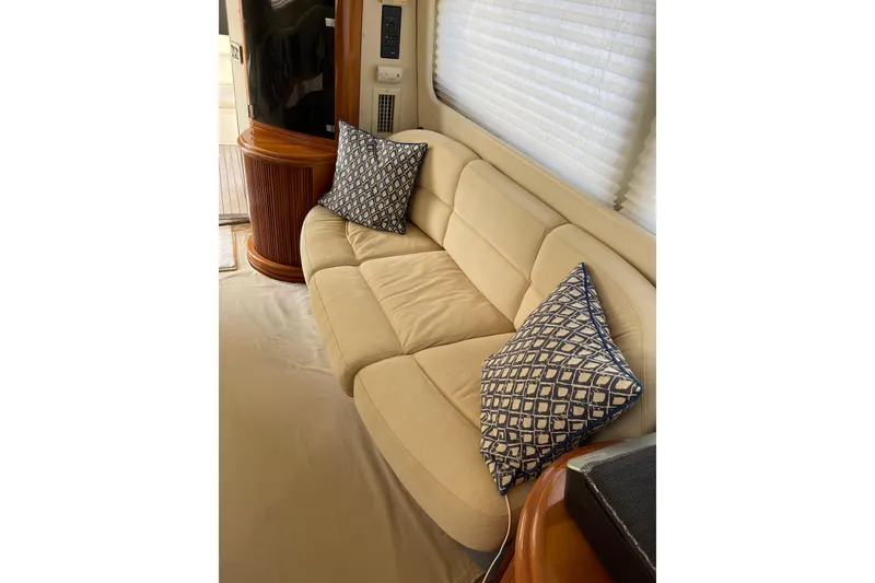 Slide: The Image of Luxurious interior of 2000 Azimut 46 Flybridge MY with beige sofa and patterned cushions. - 72